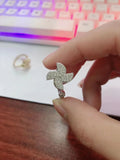 Gold and silver rotating windmill ring with geometric design
