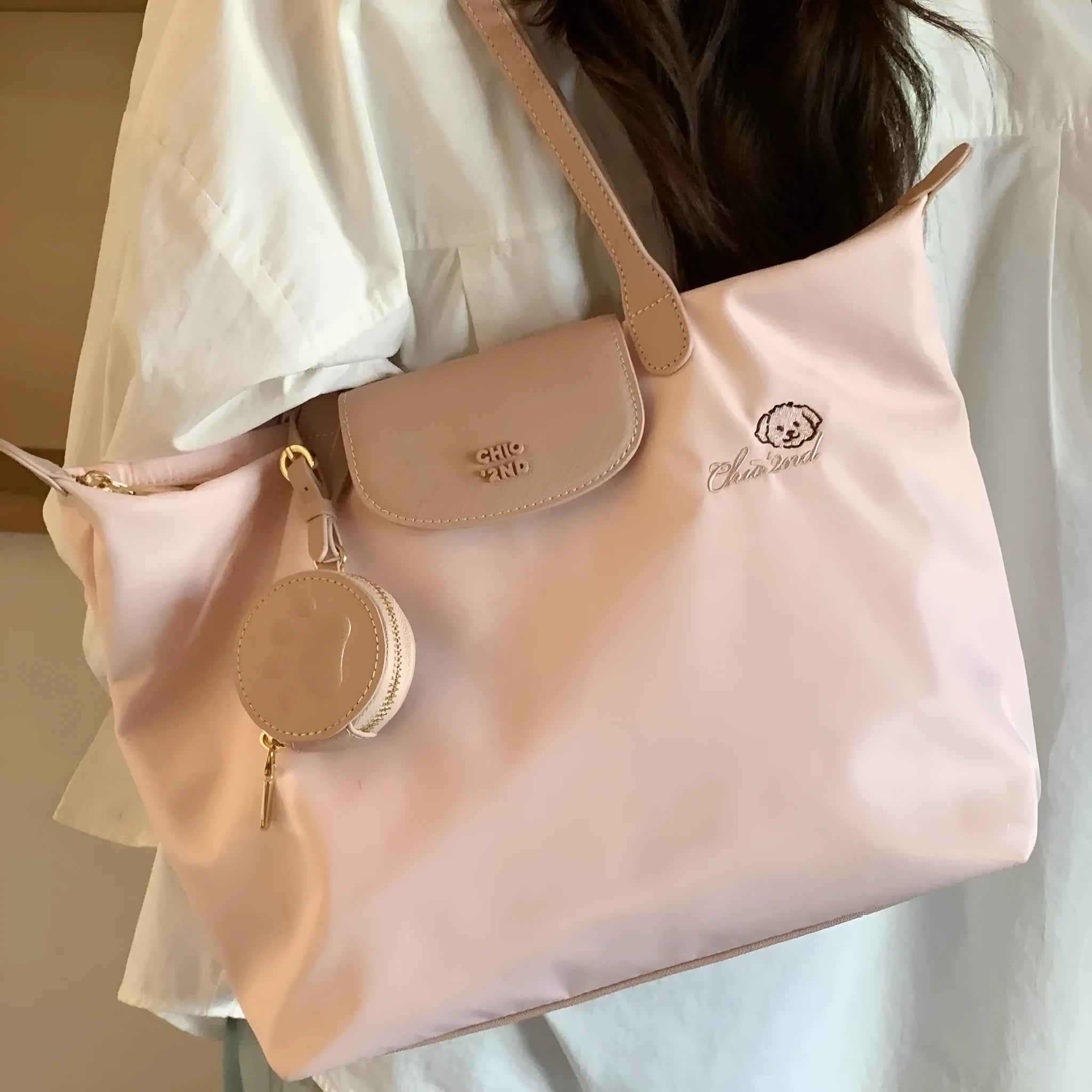 Beige Oxford cloth tote bag with sandwich pocket design and shoulder strap