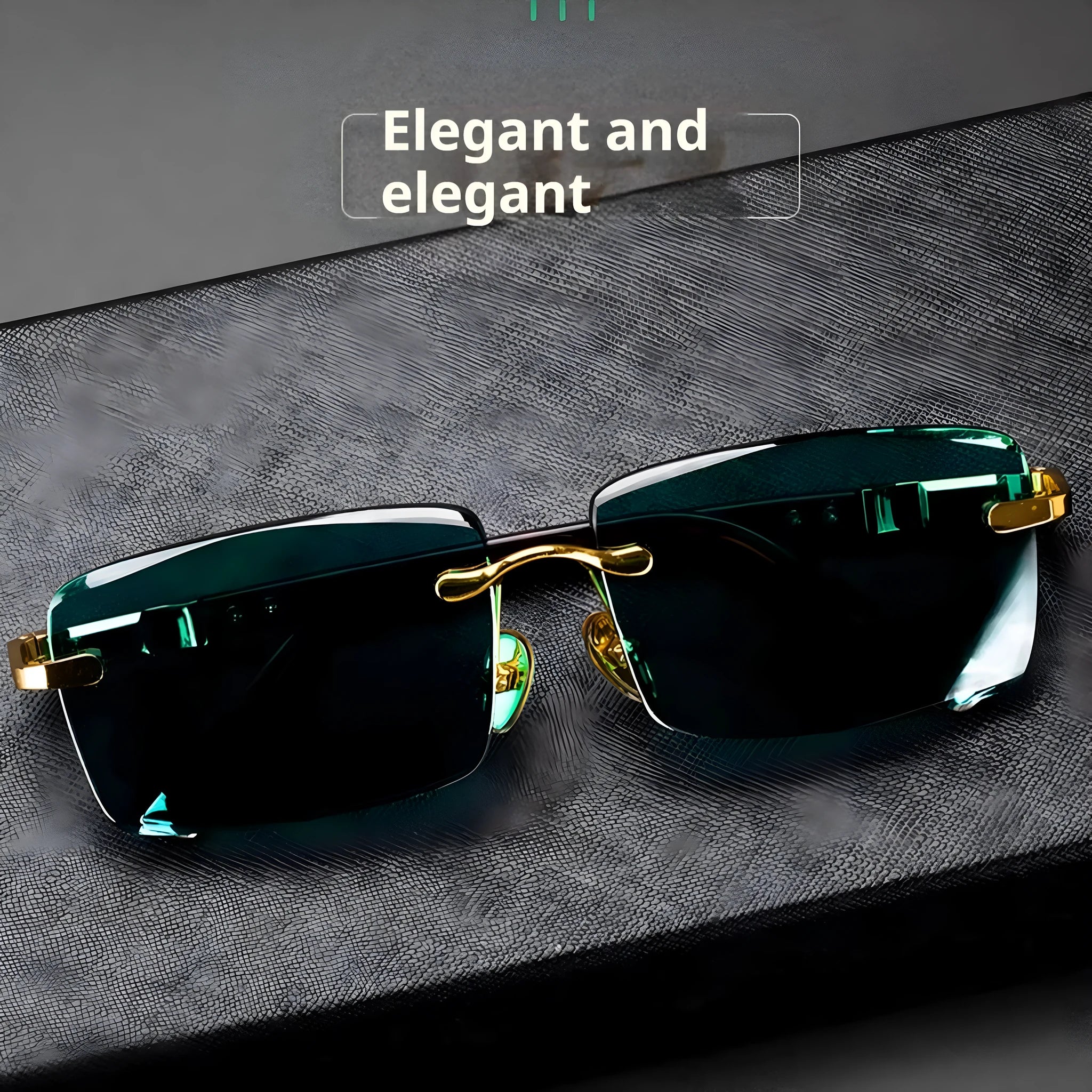 Dark green frameless crystal sunglasses with a matching case and cleaning cloth on a table.