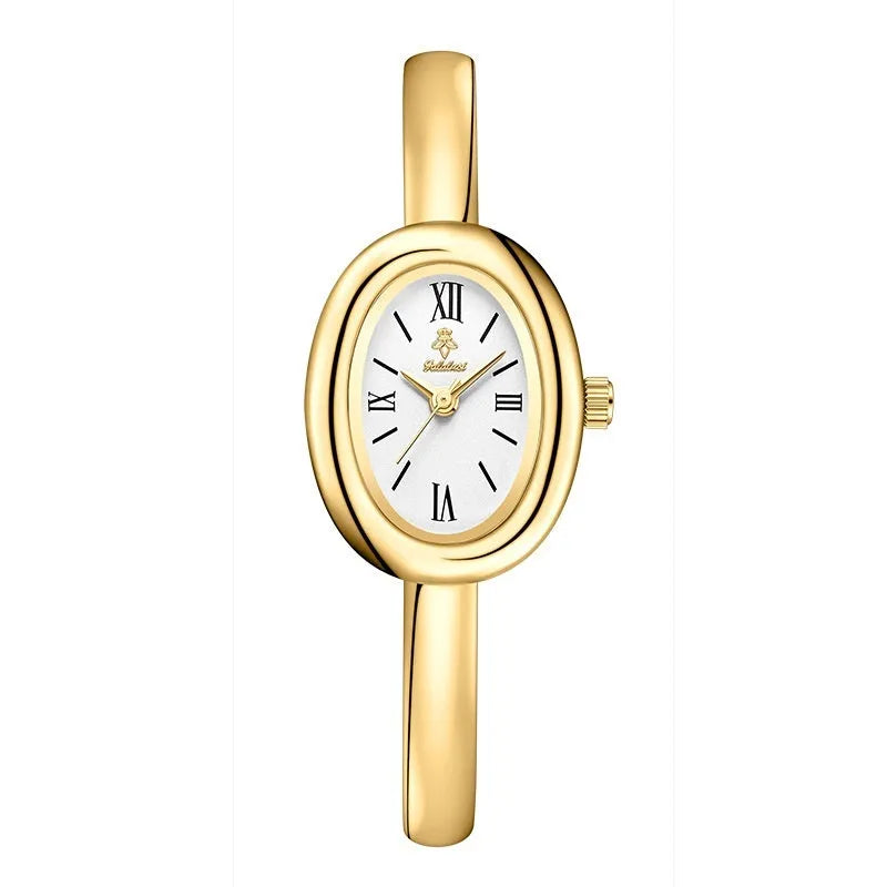 Women's retro oval quartz watch in gold colour with spiral pattern design on wrist