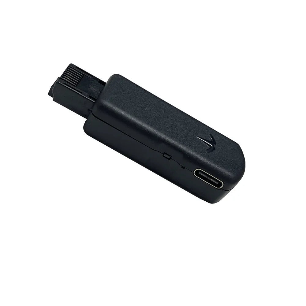 Black JB Tool USB adapter for PlayStation 5 with aluminium alloy casing and Ethernet port.