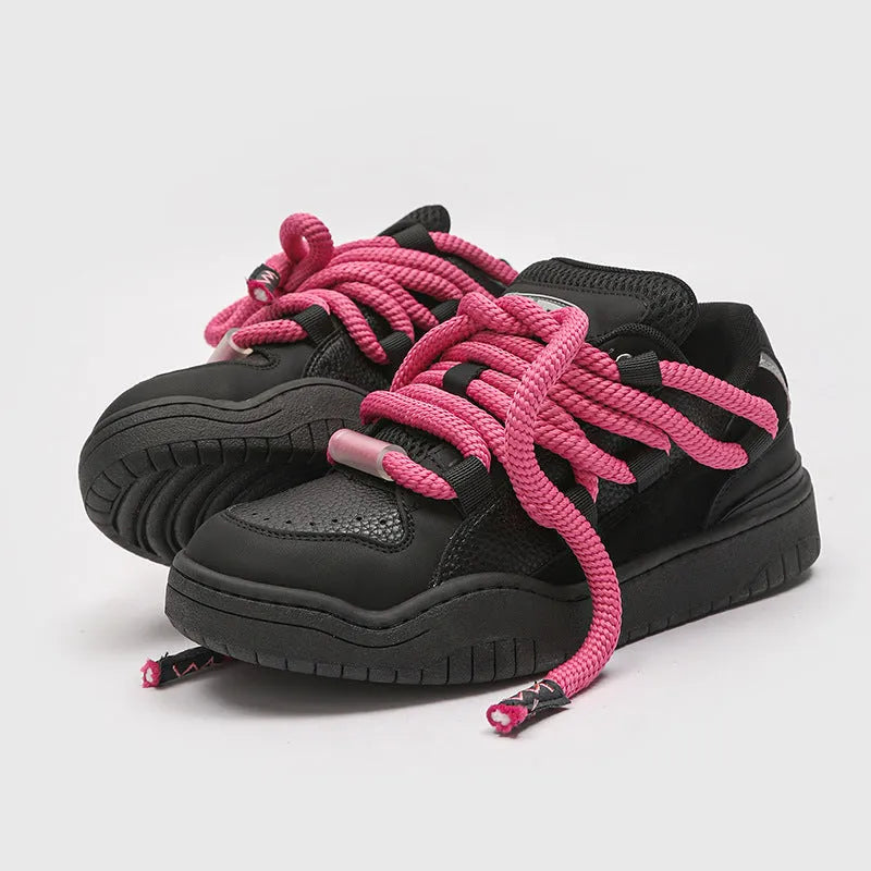 Thick bottom lace-up casual sneakers in denim blue with a round toe and flat rubber sole.