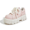 Women's beige casual leather shoes with a spring muffin heel on a rubber foam sole.