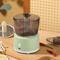 Mini electric meat grinder with transparent 225ml cup, stainless steel blades, USB charging port in white or light green