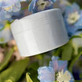 Three spiral stem brackets in green, light gray, and yellow placed on a table