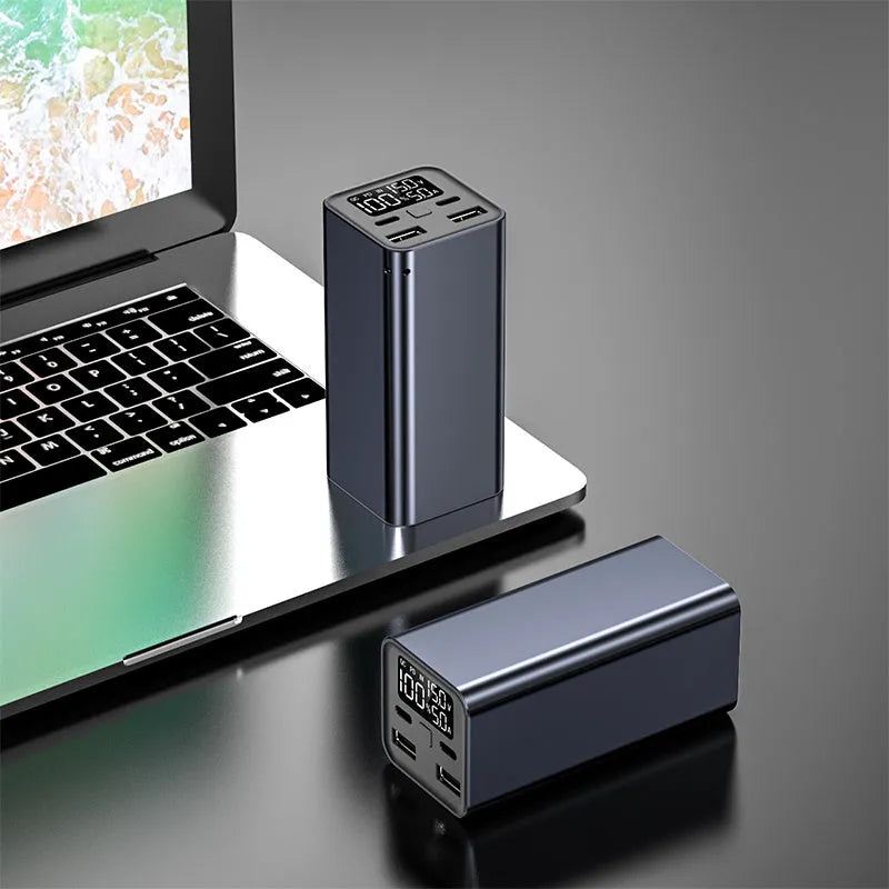 High power laptop charging bank with metal casing showing dimensions 47.5 x 104.5 x 47.5mm