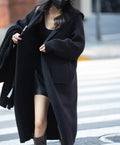 Long grey knitted cardigan sweater with hood showing 80cm length and loose fit trench coat style