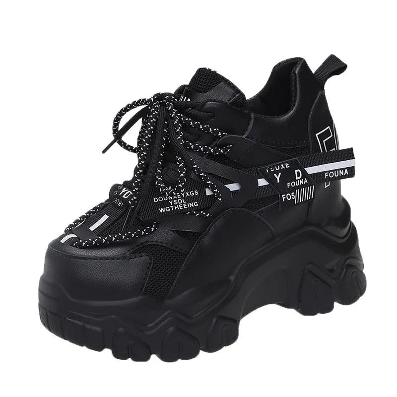 White women's low-top platform trainers with breathable mesh and a black cross-strap.
