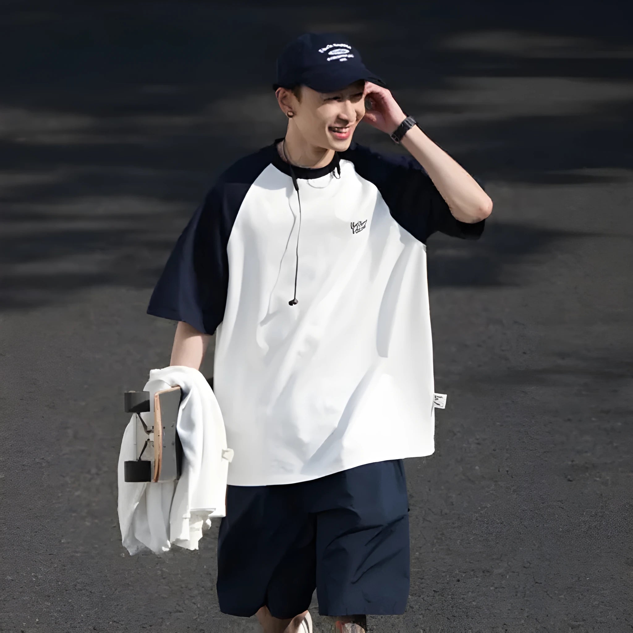 Blue casual men's t-shirt with raglan sleeves on a hanger, showing loose fit.