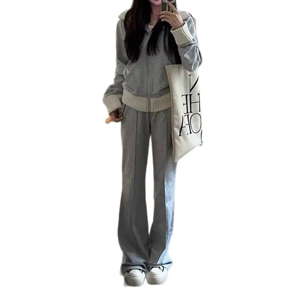 Women's light gray polyester two-piece set consisting of a pocket coat and wide leg trousers, shown flat lay view.