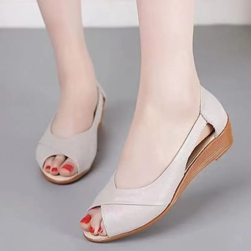 Women's black peep toe sandals with an ankle buckle and rubber sole, shown from the side.