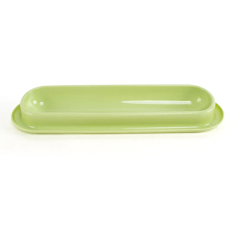Green partitioned pet feeder bowl with four sections for dog or cat dry food.