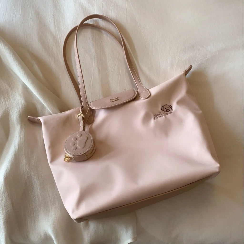 Beige Oxford cloth tote bag with sandwich pocket design and shoulder strap