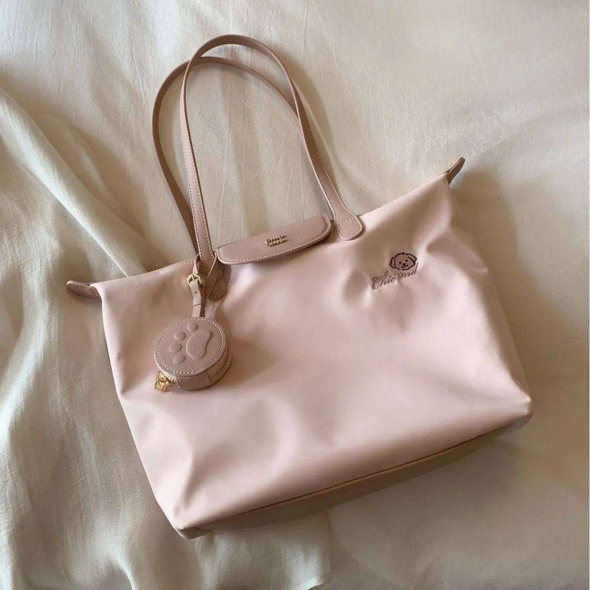 Beige Oxford cloth tote bag with sandwich pocket design and shoulder strap