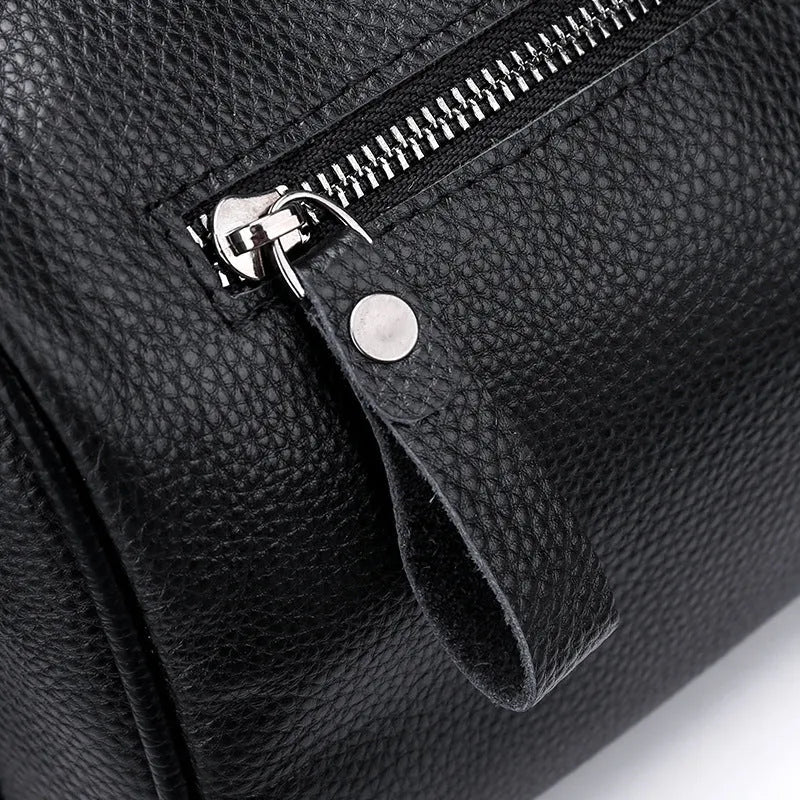 Black genuine leather one-shoulder crossbody bag showing its size and style.