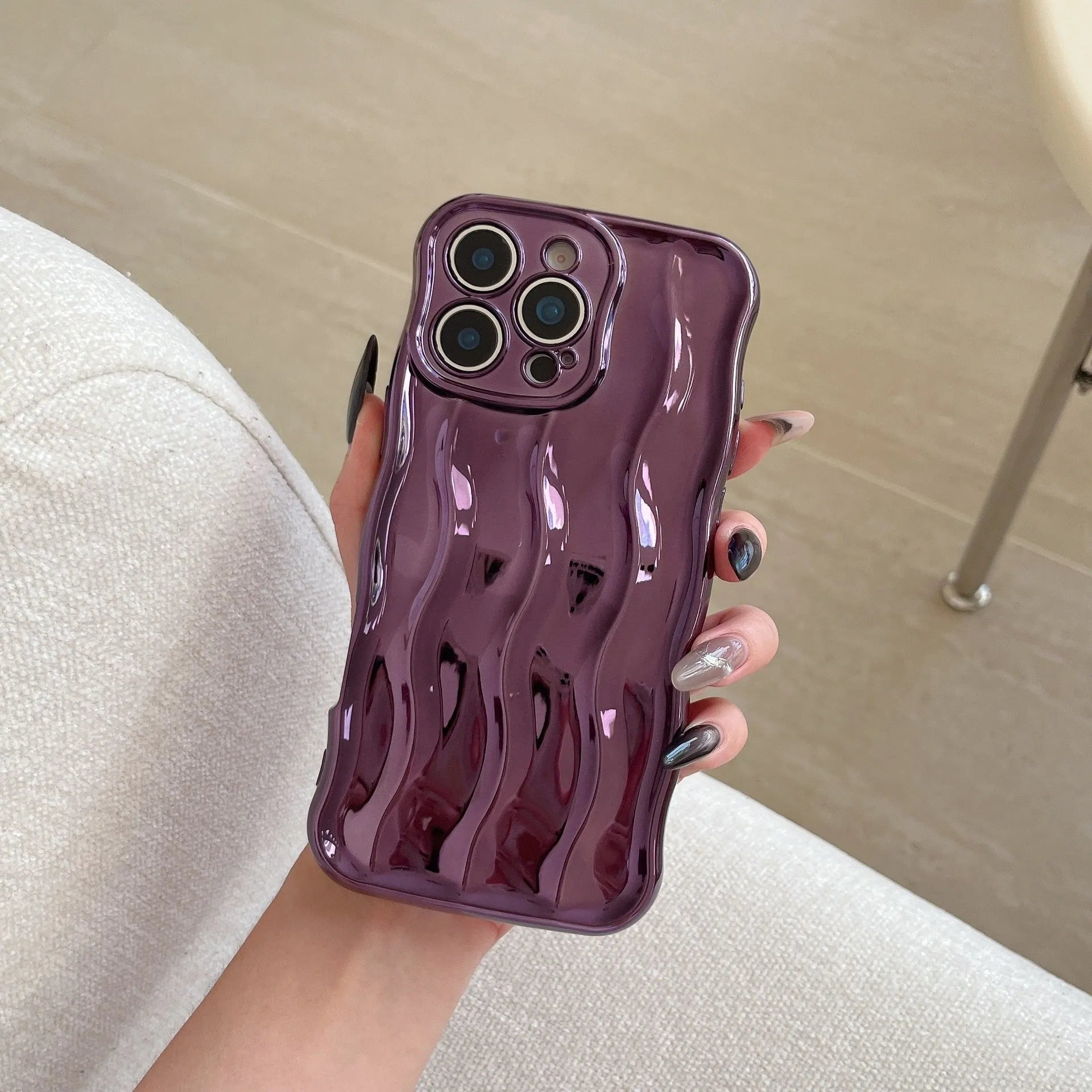 Electroplated three-dimensional wave stripe design protective case for iPhone 17 series in various colours.