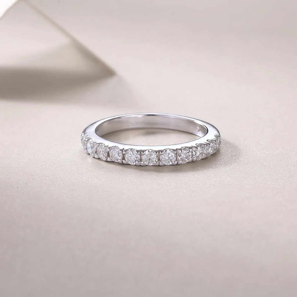 Parallel World moissanite wedding ring set in gold and rose gold on a gift box