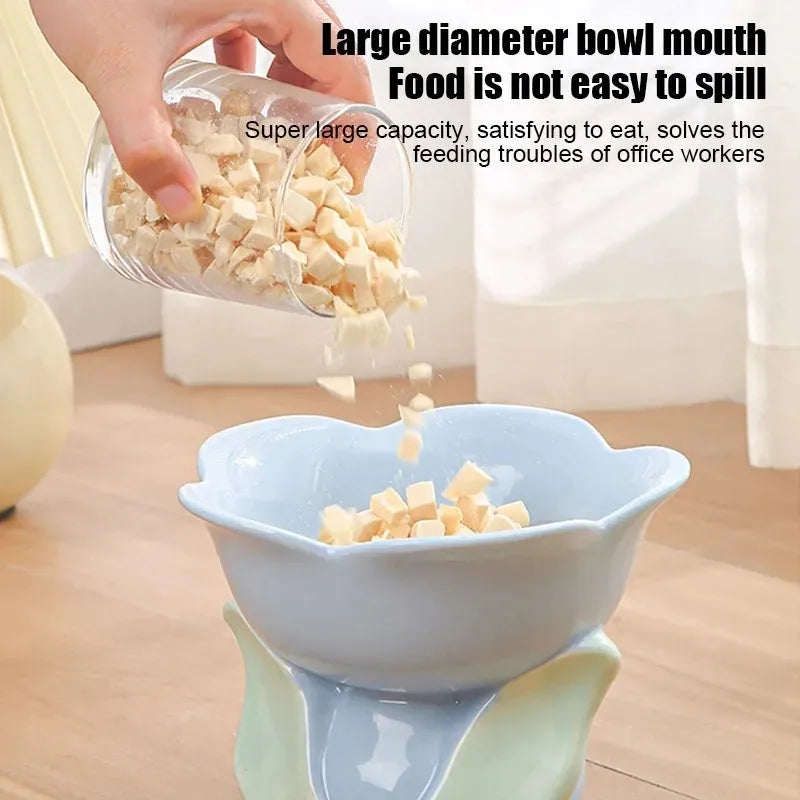 Blue ceramic raised pet bowl with floral pattern and non-slip base for cats or small dogs