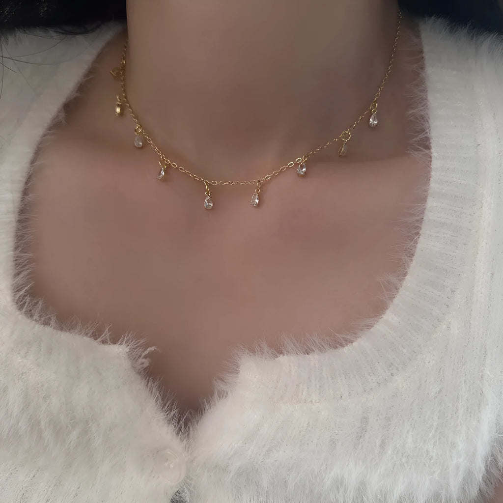 Zircon jewellery set with geometric meteor shower design including necklace, earrings and anklet
