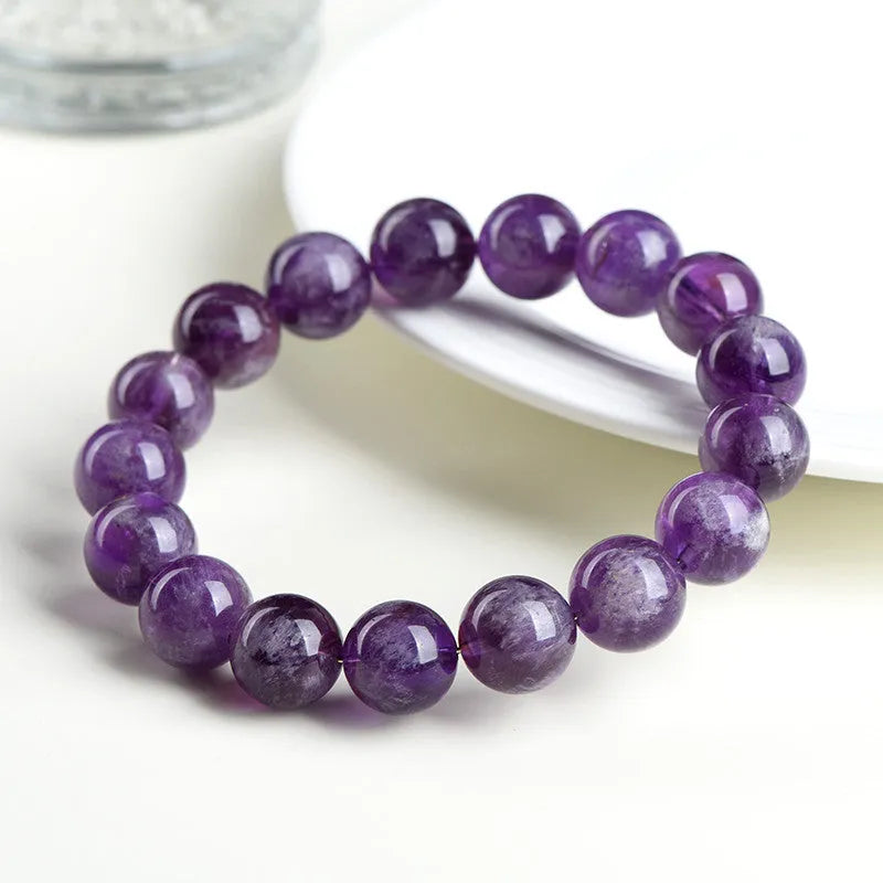 Natural Snow Mountain Purple feather amethyst crystal bracelet with geometric Ruyi pattern.