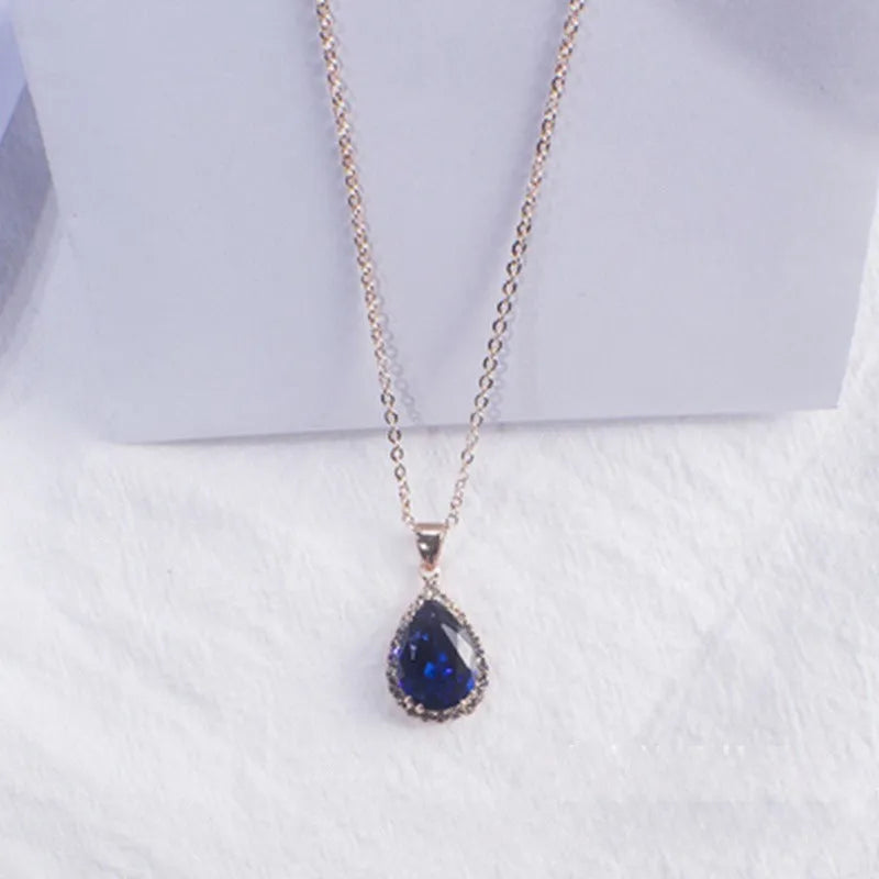 Women's geometric drop shape alloy necklace with rhinestone accents in rose gold pink colour