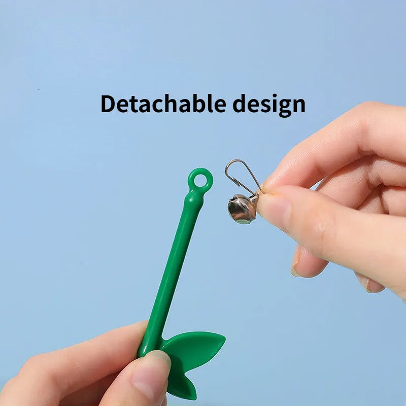 Green interactive cat feather wand toy with bells attached for indoor play and training
