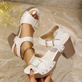 Plus size black PU leather high heel sandals with a buckle and rivet fastening and a fish mouth toe.