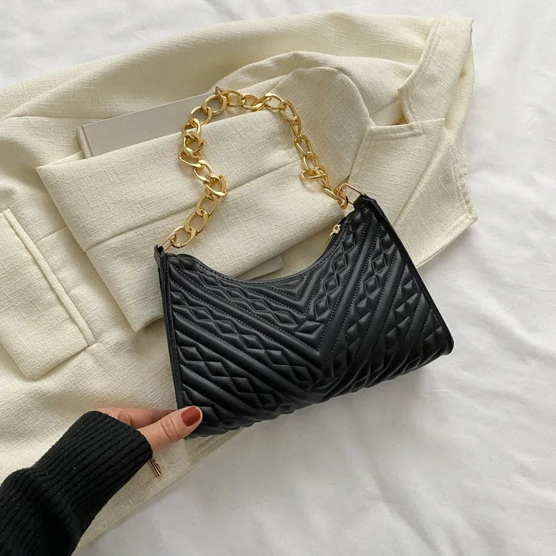 Brown pleated chain baguette shoulder bag showing vertical square shape and adjustable strap
