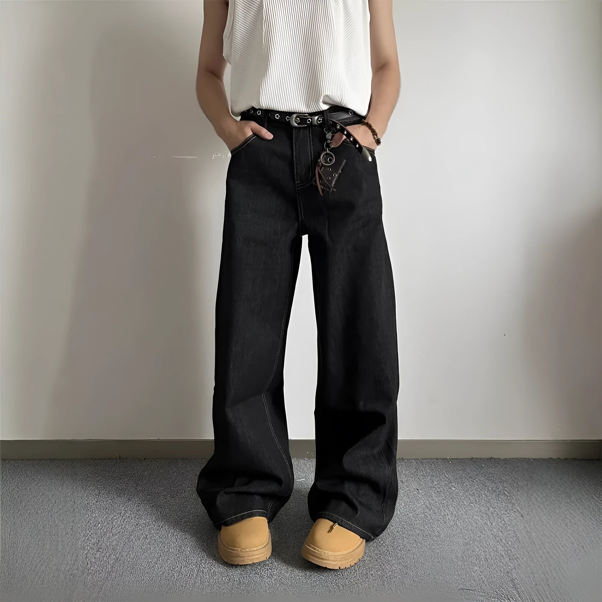 Man and woman modelling black retro wide-leg denim jeans with a straight loose fit.