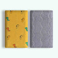 Double-sided cotton fleece pet blanket showing dinosaur print design, folded to show soft texture.