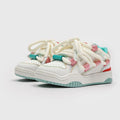 Thick bottom lace-up casual sneakers in denim blue with a round toe and flat rubber sole.
