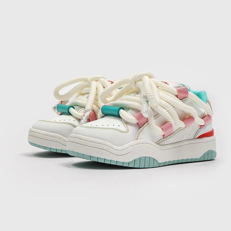 Thick bottom lace-up casual sneakers in denim blue with a round toe and flat rubber sole.