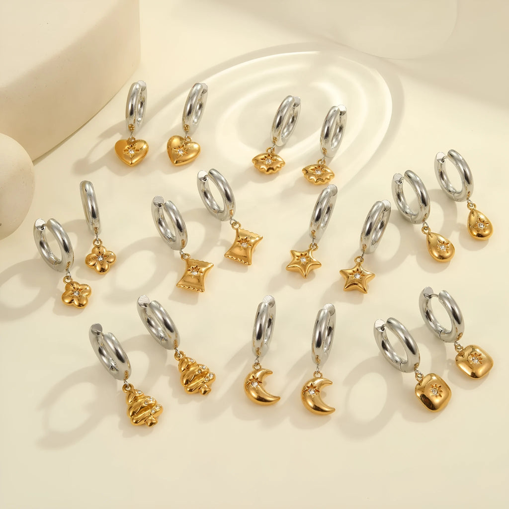 Christmas tree heart earrings in stainless steel with 18K gold plating showing star and geometric shapes