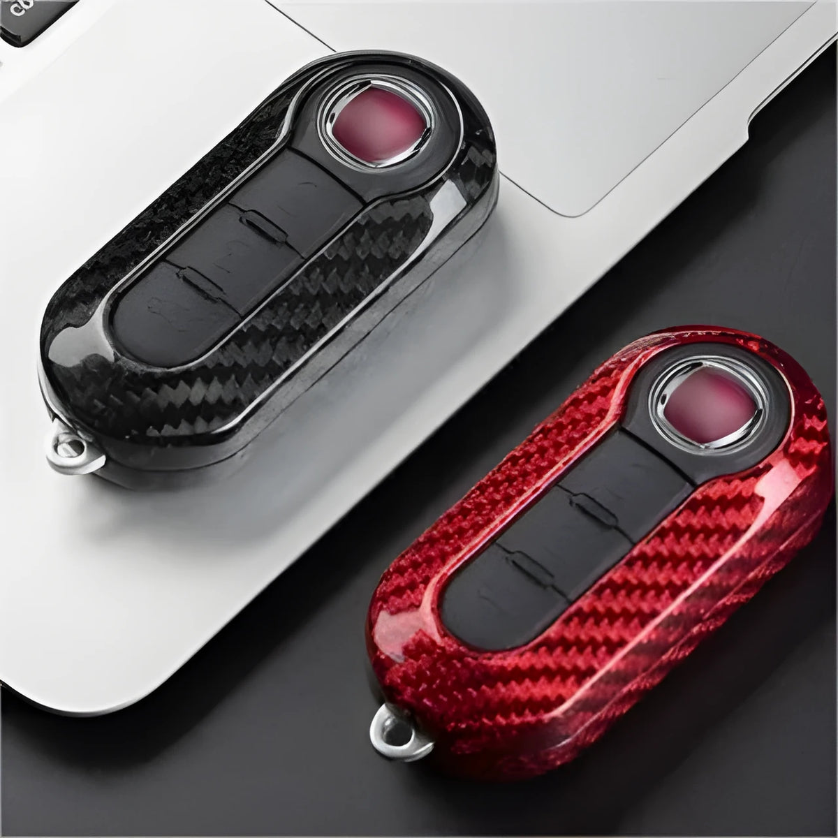 Carbon fibre vehicle key shell replacement cover showing precise button cutouts and textured surface