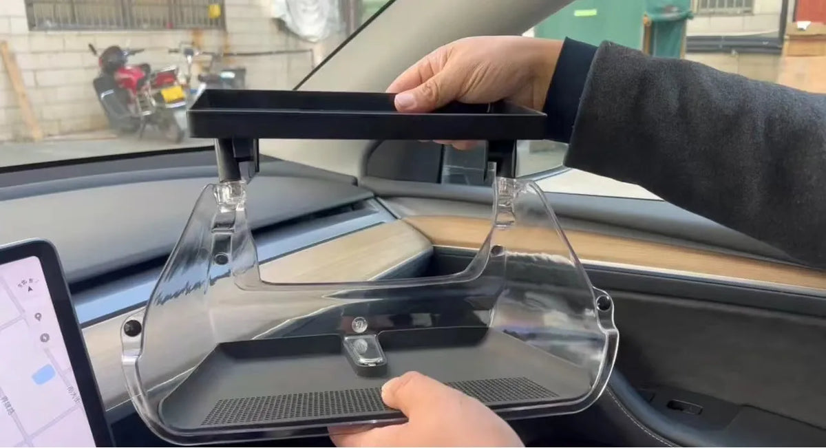 Black ABS storage box for Tesla Model 3 and Y, positioned under the centre touchscreen.