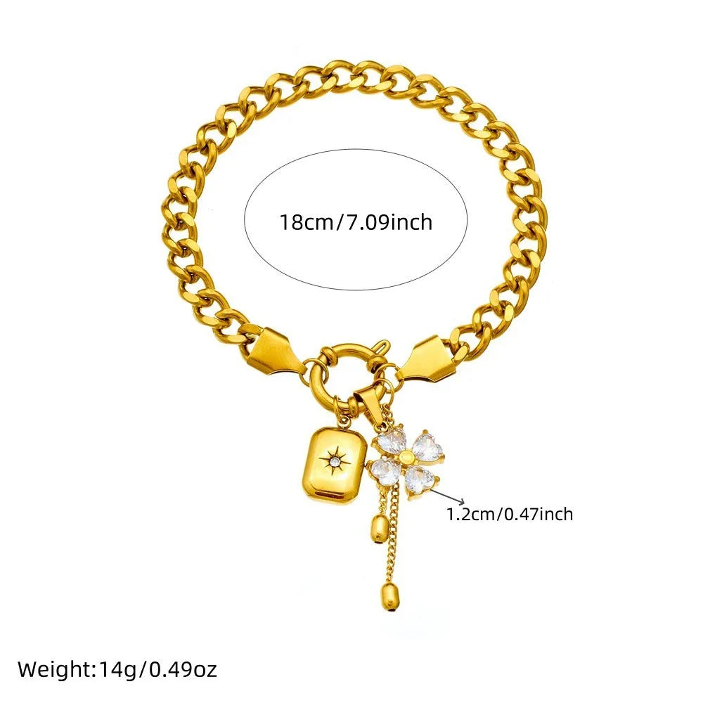 Tassel stainless steel bracelet and necklace set for women with flower and butterfly motifs on a white background