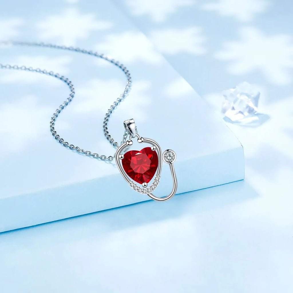 Women's copper stethoscope necklace with Red Diamond electroplated finish, medical-inspired pendant design