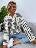Women's black striped casual top with drop-shoulder sleeves and button details