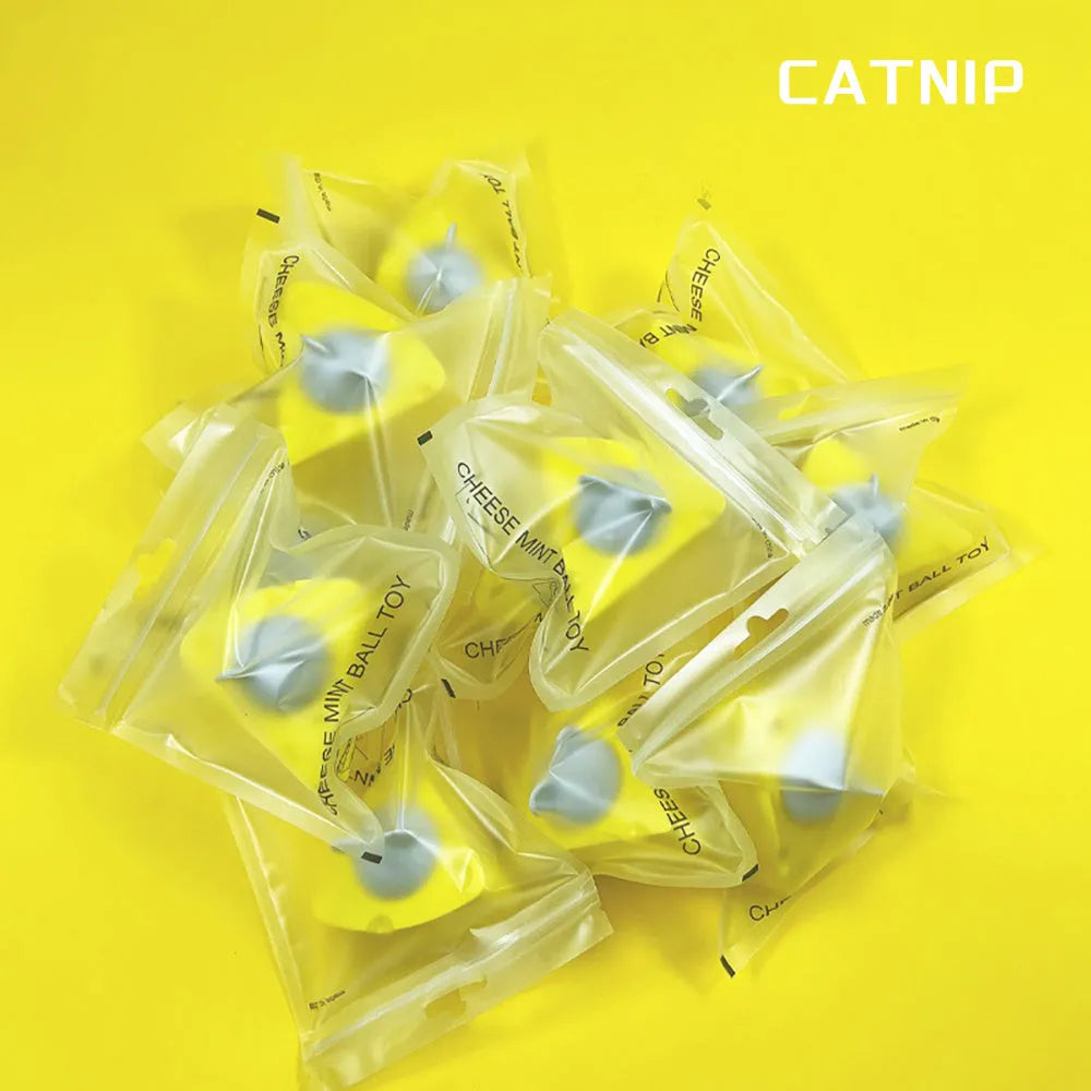 Yellow catnip and silvervine chew toy balls for cat teeth cleaning and play