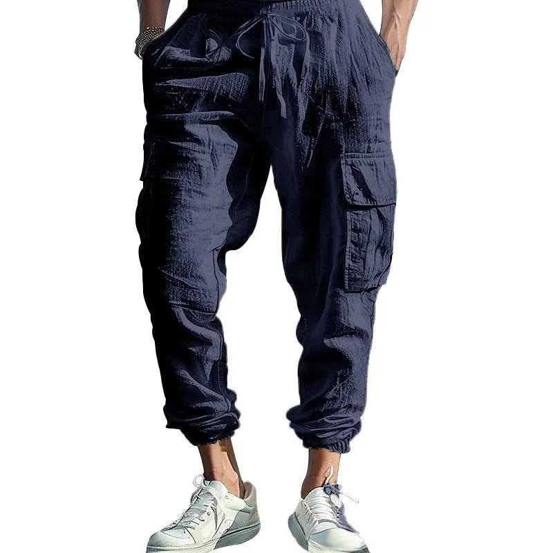 Men's solid colour linen casual trousers with ankle ties and a drawstring waist.