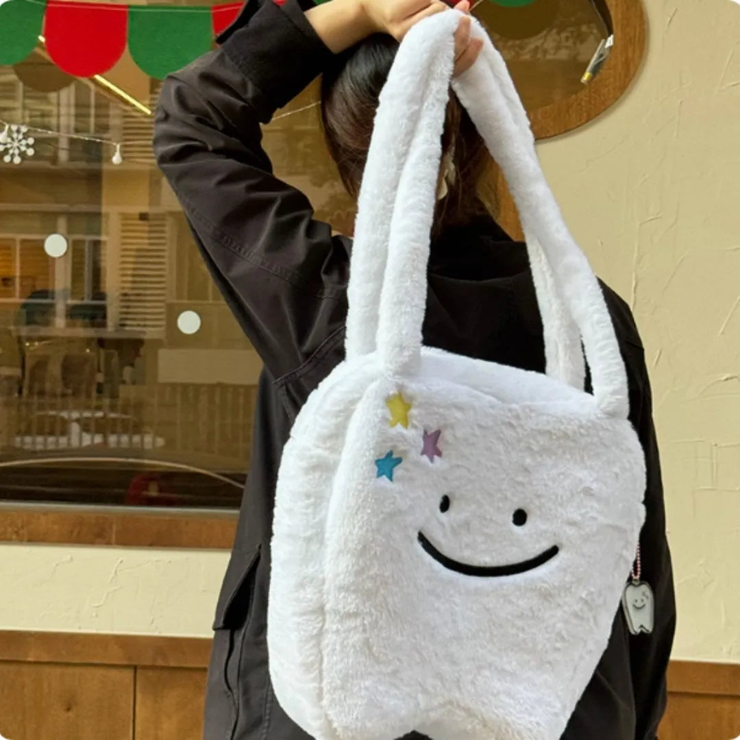 White plush tote bag with cute tooth pattern, zipper closure, and shoulder strap