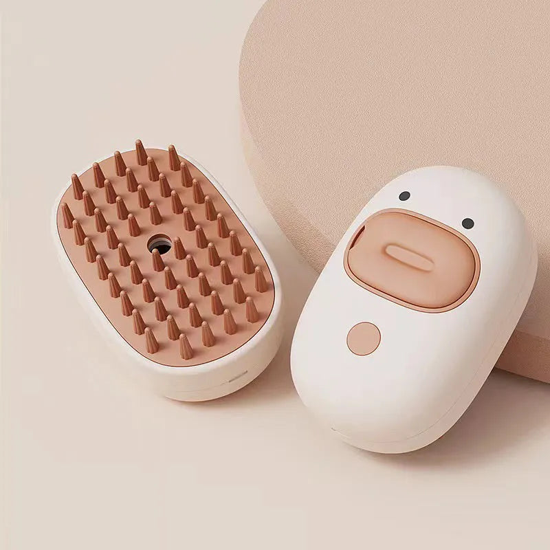 White and yellow rechargeable steam pet brush for dogs and cats on a table