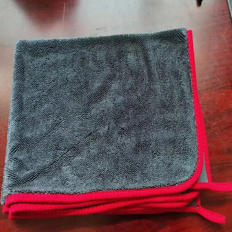 Grey car cleaning microfibre towel with a twisted braid edge, shown in various sizes for washing glass.
