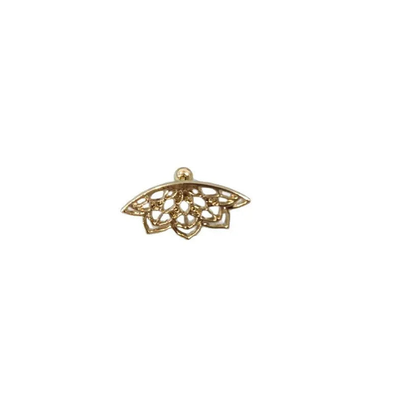 Close-up of geometric spider web patterned metal stud earrings in a gold electroplated finish.