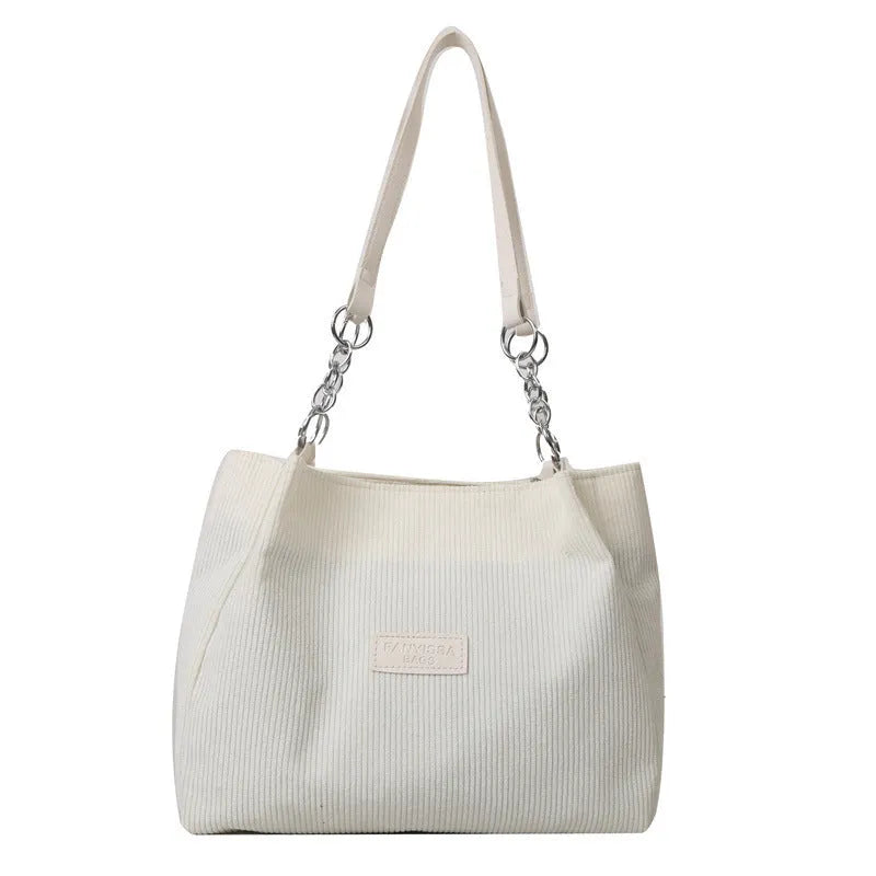 Corduroy one-shoulder tote handbag in horizontal square shape with three-dimensional pocket