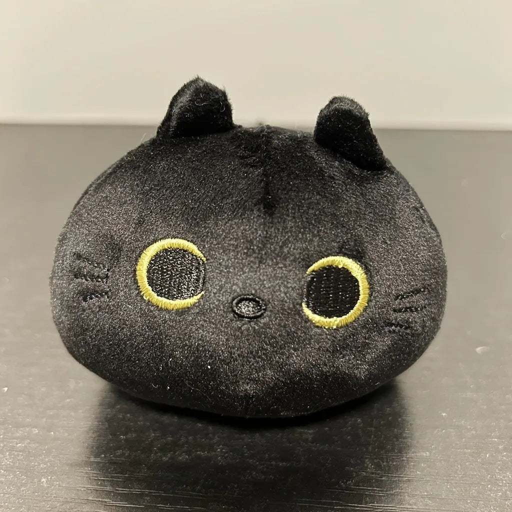 Black cat plush stuffed animal toy measuring 4 inches across