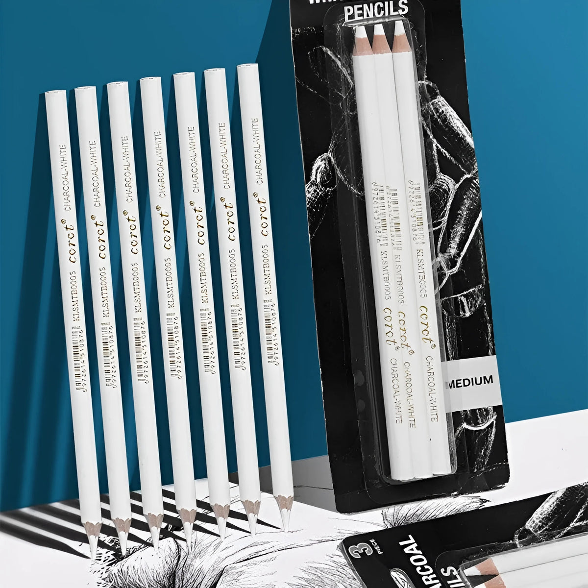 Wooden case containing three white charcoal sketching pencils for drawing on dark paper
