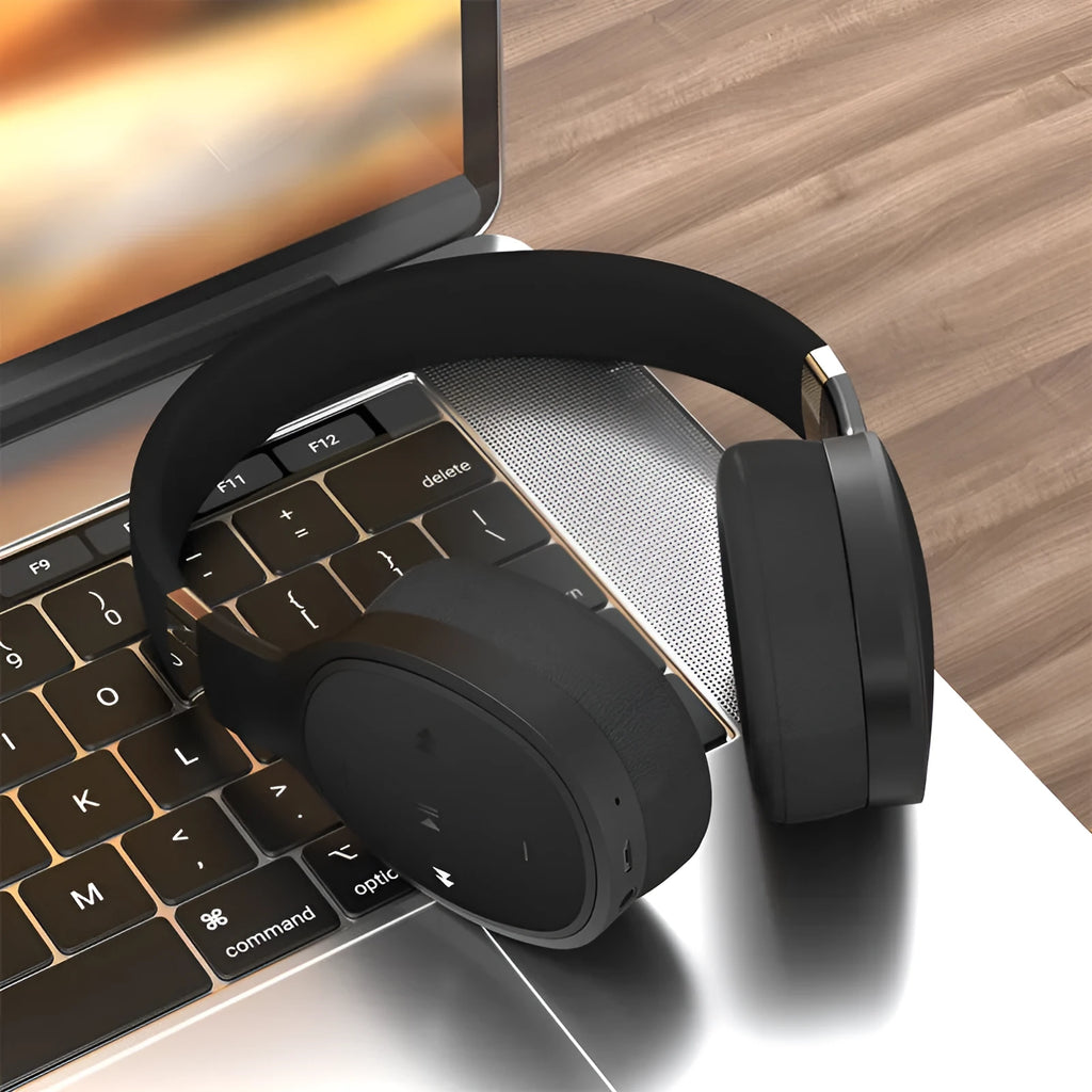 Black foldable wireless Bluetooth sports headphones with over-ear cups showing collapsible hinges.