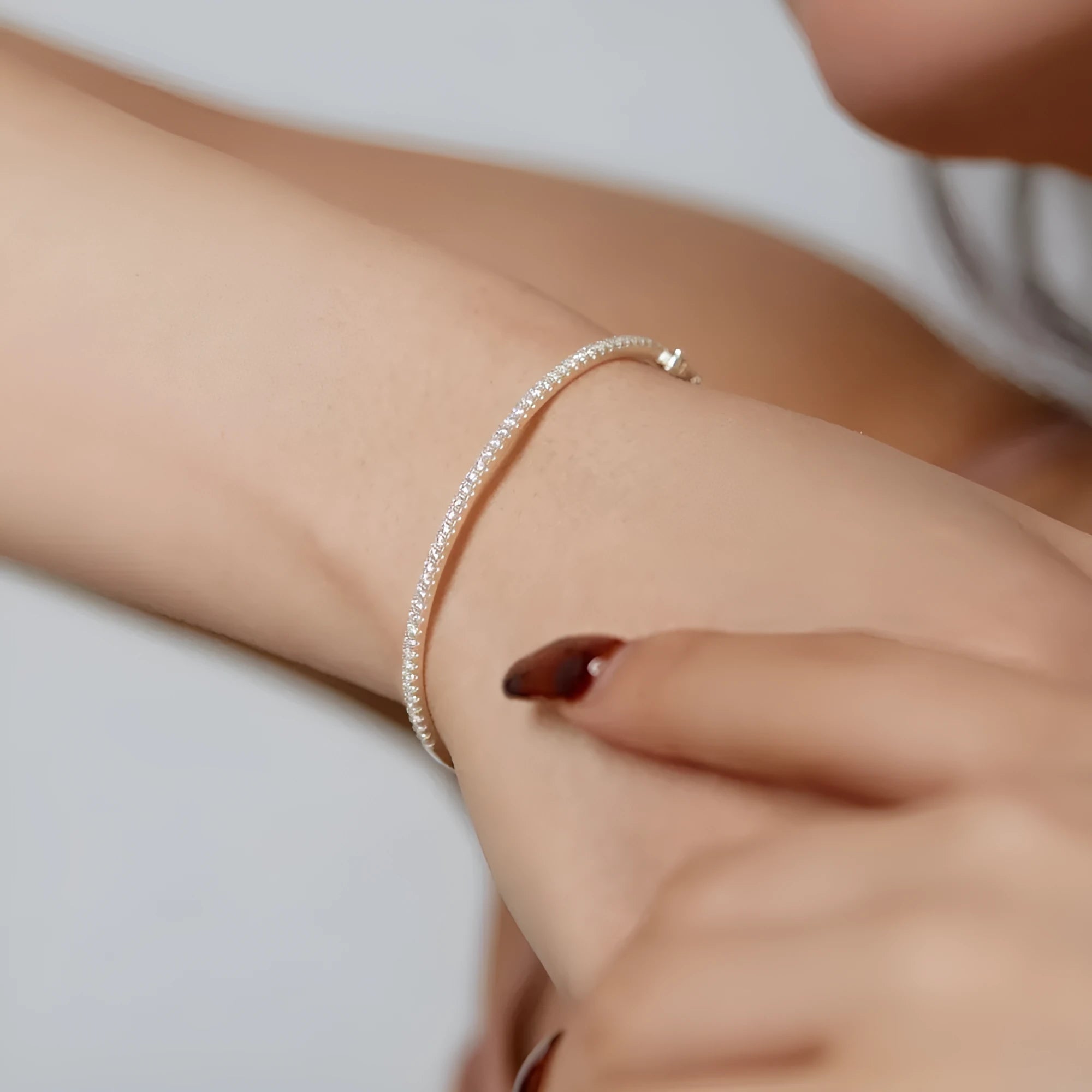 S925 sterling silver bracelet with gang drill geometric design in platinum colour on display
