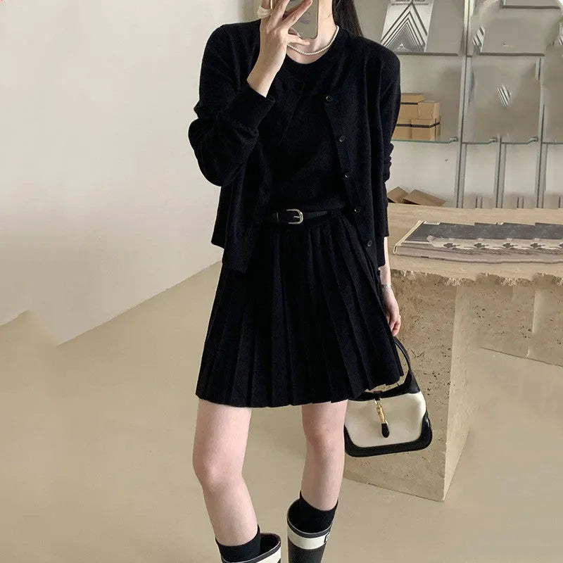 Grey women's art retro knit two-piece set featuring a pleated vest skirt with belt and a long-sleeved cardigan.